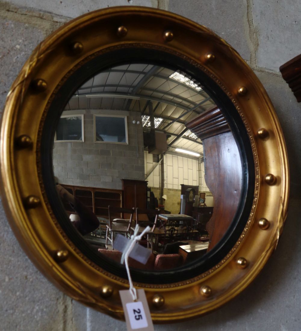 A Regency style convex wall mirror, 42cm diameter